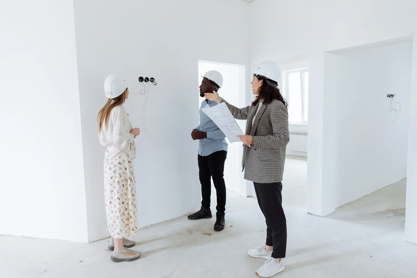 Homeowners reviewing renovation plans with a local professional